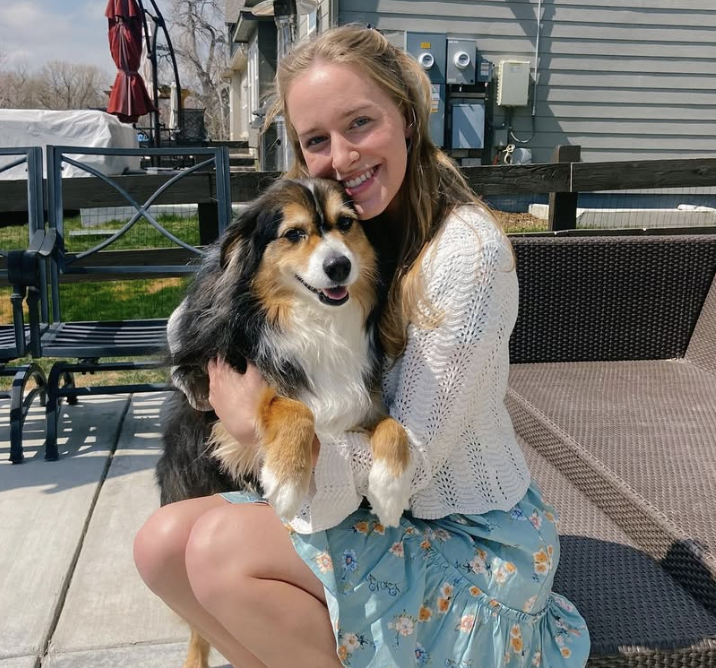 Mia Palmer smiling with her dog Skye